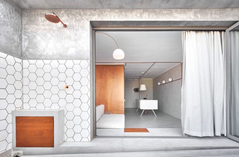 Minimalistisk lägenhet gjord med betong- och kopparrör - DigsDi