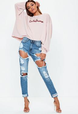 Ljusrosa grafisk långärmad T-shirt med jeans i begagnat utseende